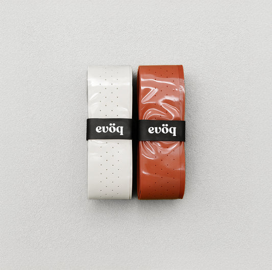 Pickleball grip, one in tan, the other in white.